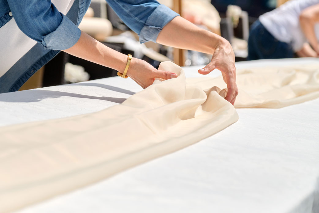 A person preparing a table for a party.